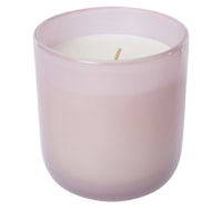 a pink candle on a white background